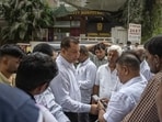A protest outside Mulund police station on Sunday sought adequate compensation for deceased Ramdhani Yadav’s family. (Satish Bate/ Hindustan Times)