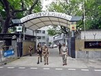 Security personnel stand guard outside the Enforcement Directorate (ED) office in New Delhi.