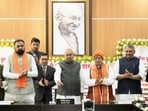Bihar chief minister Nitish Kumar along with Deputy CMs Samrat Choudhary and Vijay Sinha transfers  <span class='webrupee'>₹</span>10,000 each to 2.5 million women under Mukhyamantri Mahila Rojgar Yojana at Sankalp, 1, Anne Marg in Patna on Monday. (Santosh Kumar/HT)
