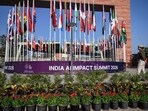 A Delhi police personnel stands guard at the Bharat Mandapam on the eve of the 'India AI Impact Summit 2026' in New Delhi.