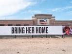 TUCSON, ARIZONA - FEBRUARY 12: A banner hangs outside of News 4 Tucson on February 12, 2026 in Tucson, Arizona. Law enforcement officials have claimed to have found several items of evidence as searches continue for Nancy Guthrie, the 84-year-old mother of U.S. journalist and television host Savannah Guthrie, after she went missing from her home on the morning of February 1st. (Photo by Brandon Bell / GETTY IMAGES NORTH AMERICA / Getty Images via AFP)
