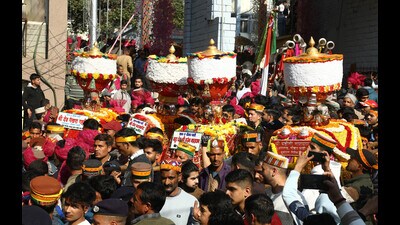 The seven-day International Maha Shivratri festival began in Mandi on Monday with the first procession led by the presiding deity Raj Madhav Rao and the flag hoisting at the historic Paddal Ground. (Birbal Sharma/ HT)