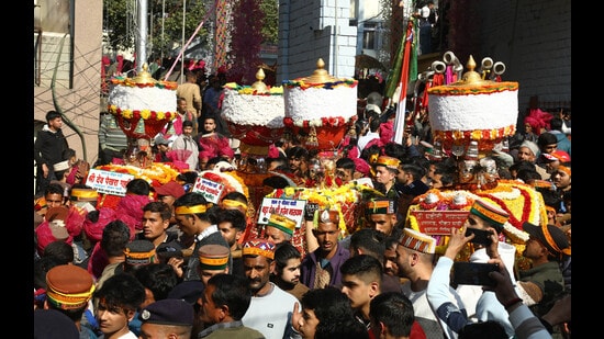 The seven-day International Maha Shivratri festival began in Mandi on Monday with the first procession led by the presiding deity Raj Madhav Rao and the flag hoisting at the historic Paddal Ground. (Birbal Sharma/ HT)