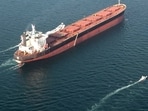 This handout photo released by Iran's Revolutionary Guards Corps (IRGC)'s official website Sepanews on February 17, 2026, shows boats manoeuvering around a tanker vessel during a military exercise by members of the IRGC and navy in the Strait of Hormuz.
