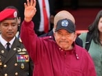 Nicaragua's President Daniel Ortega waves after attending the swearing-in ceremony of Venezuela's President Nicolas Maduro for a third term at the National Assembly in Caracas, Friday on January 10, 2025.