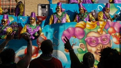 Revelers take part in the Mardi Gras parade in New Orleans, Louisiana, on February 15, 2026. (Photo by Sandy HUFFAKER / AFP) (AFP) Revelers take part in the Mardi Gras parade in New Orleans, Louisiana, on February 15, 2026. (Photo by Sandy HUFFAKER / AFP) (AFP)
