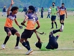 Hockey players in action during the Kila Raipur games in Ludhiana on Wednesday. (Gurpreet Singh/HT)