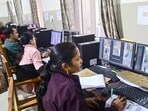 Officials monitor at a control room as students appear for the UP Board exams, in Prayagraj, Wednesday. (PTI Photo)