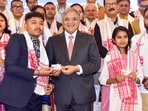Chief Election Commissioner Gyanesh Kumar with a first time voter ahead of the Assam Assembly Elections, in Guwahati. 
