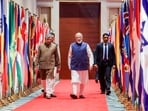 Prime Minister Narendra Modi with Union Minister of Information Technology Ashwini Vaishnaw during the India AI Impact Summit, at Bharat Mandapam in New Delhi. 