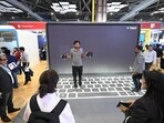 Visitors at the Microsoft pavilion at the AI Impact Summit 2026 at Bharat Mandapam in New Delhi on Tuesday. (Sanjeev Verma/HT Photo)