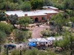 Nancy Guthrie's house seen in an aerial view with tents visible amid an ongoing search for the 84-year-old. 