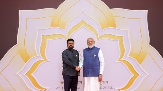 Prime Minister Narendra Modi exchanges a handshake with Sri Lanka President Anura Kumara Dissanayake during the India AI Impact Summit, at Bharat Mandapam in New Delhi.&nbsp;(PMO)