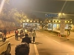 A picture shows AI Summit attendees walking on the road as cabs were barred 