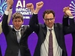 Dario Amodei (R) and Sam Altman (L) share the stage at the India AI Impact Summit in Delhi on February 19, 2026 