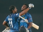 Kumar Sangakkara and Thisara Perera celebrate Sri Lanka’s World Twenty20 triumph in 2014. (Getty Images)
