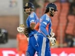 India's captain Suryakumar Yadav, left, and Tilak Varma run between the wickets during a T20 World Cup 2026 match against Netherlands