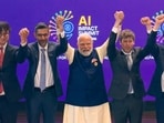 Prime Minister Narendra Modi, centre, joins hands with Google CEO Sundar Pichai, OpenAI CEO Sam Altman and others during the India AI Impact Summit 2026, in New Delhi.