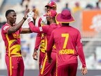 WI vs ITA Highlights, T20 World Cup: West Indies' Shamar Joseph with teammates celebrates after taking a wicket.