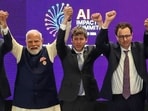 Prime Minister Narendra Modi takes a group photo with AI company leaders including OpenAI CEO Sam Altman and Anthropic CEO Dario Amodei at the AI Summit in New Delhi.