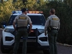 TUCSON, ARIZONA - FEBRUARY 18: Pima County deputy sherrifs stand in the driveway of the residence of Nancy Guthrie on February 18, 2026, in Tucson, Arizona. (Photo by JOE RAEDLE / GETTY IMAGES NORTH AMERICA / Getty Images via AFP)
