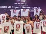 Indian Youth Congress workers stage a topless protest at Bharat Mandapam during the India AI Impact Summit 2026, in New Delhi on Friday. 