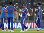 India's Suryakumar Yadav celebrates with teammates after the match. 