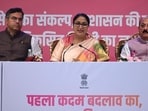 Delhi CM Rekha Gupta presents her report during a press conference. (Sanchit Khanna/HT Photo)