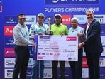 Om Prakash Chouhan (centre) receives the DP World Players Championship trophy. (PGTI)