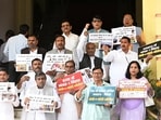 RJD legislators demonstrate during the Budget Session outside the Bihar Assembly in Patna on Friday. (Santosh Kumar/HT)