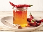 Sweet-spicy, or “swicy”, is the flavour of hot honey that‘s being drizzled all over desserts and snacks. (SHUTTERSTOCK)
