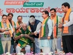 Union Ministers Gajendra Singh Shekhawat, centre, and Pralhad Joshi, third right, with LoP in the state Legislative Assembly R Ashoka, second left, BJP leader BS Yediyurappa, fourth left, and others during the BJP Karnataka state executive committee meeting, in Bengaluru on Thursday. (PTI)