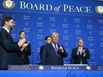 US President Donald Trump (C) gestures as he arrives for the inaugural meeting of the "Board of Peace" at the US Institute of Peace in Washington, DC, on Thursday