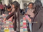An author was seen negotiating with a street vendor selling a pirated version of her own book. An author was seen negotiating with a street vendor selling a pirated version of her own book.