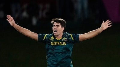 Xavier Bartlett started things off with a bang, taking the wicket of Aamir Kaleem with the very first ball. Australia made the rare decision to bowl pace through the powerplay, and it paid off against a hapless Oman top order. (AP)