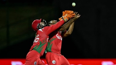 Oman's brief moment of joy in the match came with the wicket of Travis Head, but even that was nearly a comedy of errors. Miscommunication between wicketkeeper Vinayak and bowler Shakeel Ahmed leading to a bobble, but the bowler ultimately holding on and tearing off in celebration. (AFP)