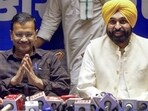 Aam Aadmi Party (AAP) national convener Arvind Kejriwal and Punjab chief minister Bhagwant Mann address a press conference on the recent Gujarat state Budget on the first day of their two-day visit to Gujarat, in Ahmedabad on Saturday. (ANI)
