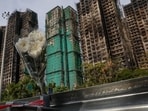 Hong Kong proposes to spend about HK$4 billion ($512 million) to buy out the owners of homes in a high-rise housing complex ravaged by a massive fire
