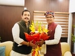 Himachal Pradesh public works department minister meets Union minister for rural development Shivraj Singh Chouhan on Saturday in New Delhi. (HT Photo)
