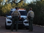 Pima County deputy sherrifs stand in the driveway of the residence of Nancy Guthrie on February 18, 2026, in Tucson, Arizona. 