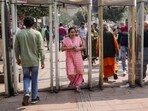 People pass through metal detectors installed near the Red Fort amid heightened security following intelligence inputs about a suspected IED threat in the Chandni Chowk area, in New Delhi on Saturday, Feb 21, 2026.