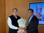 Punjab industries and commerce and investment promotion minister Sanjeev Arora with industrialist and JSW Group chairman Sajjan Jindal in Mumbai on Friday. (HT)