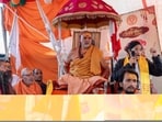 Swami Avimukteshwaranand Saraswati, head of Jyotish Peeth Badrinath, sits with followers outside his Magh Mela camp in protest 