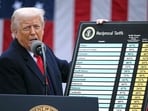(FILES) US President Donald Trump holds a chart as he delivers remarks on reciprocal tariffs during an event in the Rose Garden entitled "Make America Wealthy Again" at the White House in Washington, DC, on April 2, 2025. The US Supreme Court ruled on February 20, 2025 that Donald Trump exceeded his authority in imposing a swath of tariffs that upended global trade, blocking a key tool the president has wielded to impose his economic agenda. (Photo by Brendan SMIALOWSKI / AFP)