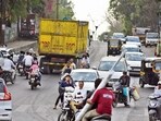 A local shopkeeper said wet garbage spilling from dumpers often makes the road slippery.  (MAHENDRA KOLHE/ HT)