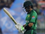Pakistan's Babar Azam walks off after being dismissed. 