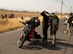 Soldiers check motorcycle drivers after organized crime burned vehicles to block roads following a federal operation in which a government source said Mexican drug lord Nemesio Oseguera, commonly known as "El Mencho," was killed, in Zapopan, Mexico.