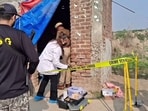 Officials inspect the crime spot in Adhian village of Gurdaspur district on Sunday. (HT)