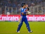 Suryakumar Yadav returns to the pavilion after his dismissal by South Africa's Corbin Bosch.