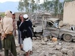 Residents gather at the site of a Pakistani airstrike in Nangarhar province of Afghanistan on Sunday. (Reuters)
